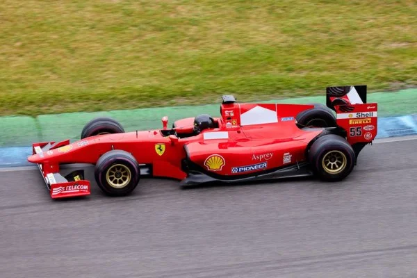 formula 1 cars racing on track